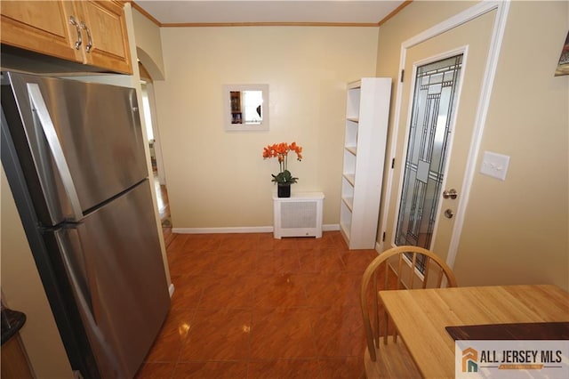 25 Clover Ave, Colonia, NJ 07067 - kitchen with freestanding refrigerator, crown molding, tile patterned flooring, and baseboards