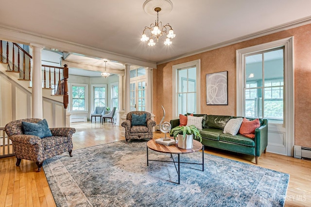 44 Rector St, Metuchen, NJ 08840 - living room featuring a chandelier, hardwood / wood-style floors, decorative columns, ornamental molding, and baseboard heating