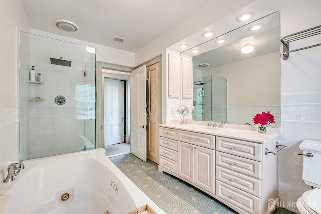 44 Rector St, Metuchen, NJ 08840 - full bathroom featuring a whirlpool tub, tiled shower, toilet, vanity, and tile walls