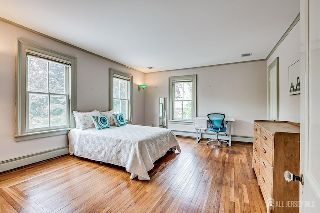 44 Rector St, Metuchen, NJ 08840 - bedroom with crown molding, baseboard heating, and wood-type flooring