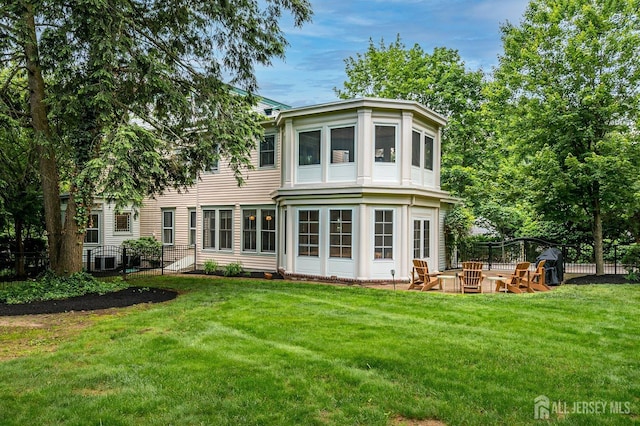 44 Rector St, Metuchen, NJ 08840 - back of property with a yard and an outdoor fire pit