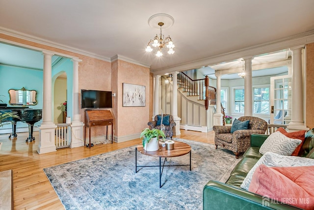 44 Rector St, Metuchen, NJ 08840 - living room with a baseboard heating unit, crown molding, ornate columns, wood finished floors, and stairway