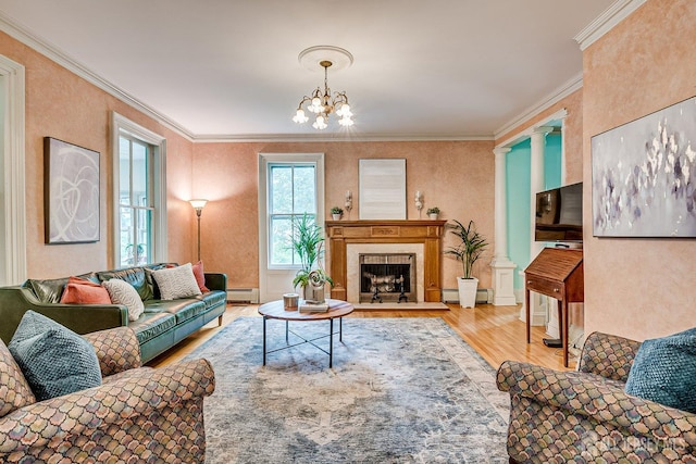 44 Rector St, Metuchen, NJ 08840 - living room with a baseboard radiator, wood finished floors, ornamental molding, a chandelier, and a premium fireplace