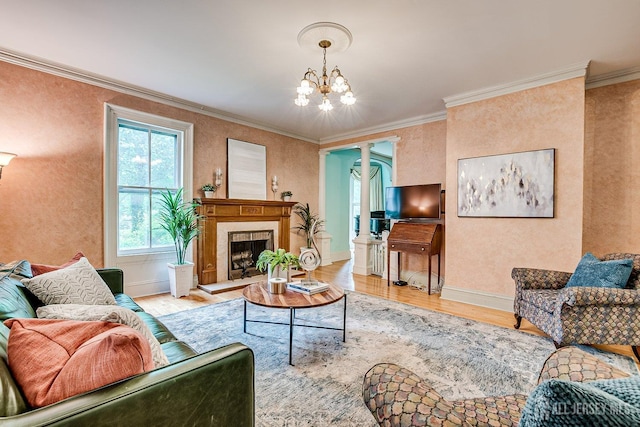 44 Rector St, Metuchen, NJ 08840 - living room featuring wood finished floors, decorative columns, a chandelier, ornamental molding, and baseboards