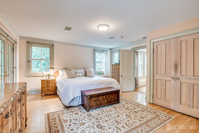 44 Rector St, Metuchen, NJ 08840 - bedroom featuring multiple windows, light wood-type flooring, and baseboards