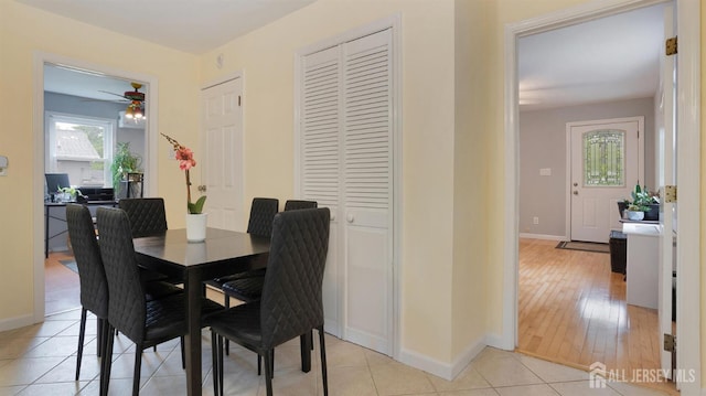 41 Ross Hall Blvd N, Piscataway, NJ 08854 - dining room with baseboards, a ceiling fan, and light wood-style flooring