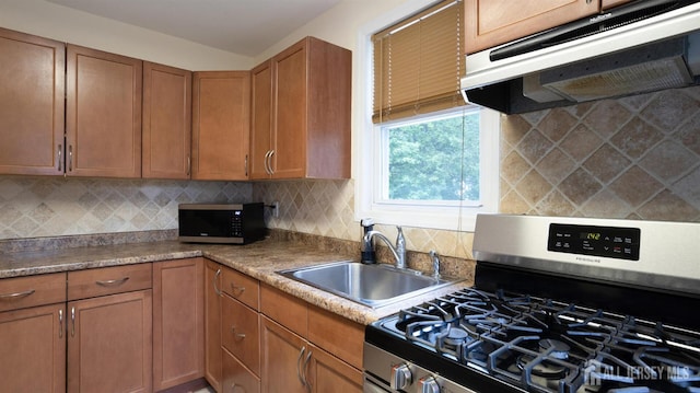 41 Ross Hall Blvd N, Piscataway, NJ 08854 - kitchen with appliances with stainless steel finishes, under cabinet range hood, a sink, brown cabinets, and backsplash