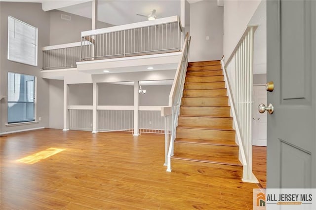 22 Witch Hazel Ct, South Brunswick, NJ 08852 - stairs with a towering ceiling and wood finished floors