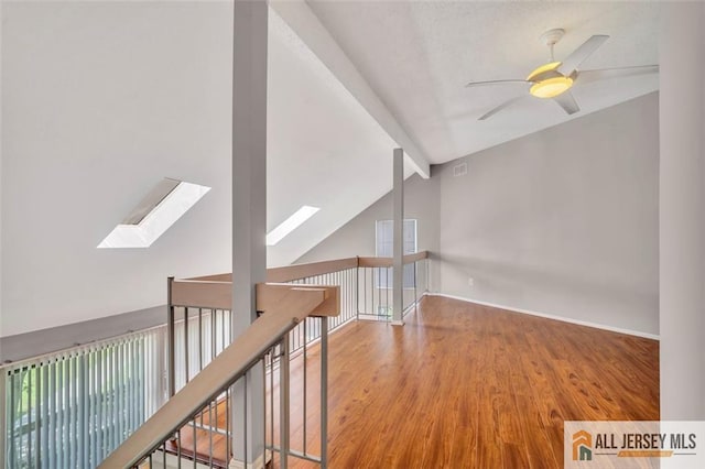 22 Witch Hazel Ct, South Brunswick, NJ 08852 - hall featuring a skylight, wood finished floors, and plenty of natural light