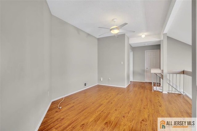 22 Witch Hazel Ct, South Brunswick, NJ 08852 - empty room featuring vaulted ceiling, ceiling fan, and wood finished floors