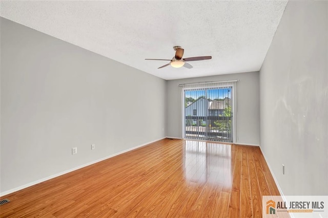 22 Witch Hazel Ct, South Brunswick, NJ 08852 - unfurnished room with light wood-style floors, ceiling fan, and a textured ceiling