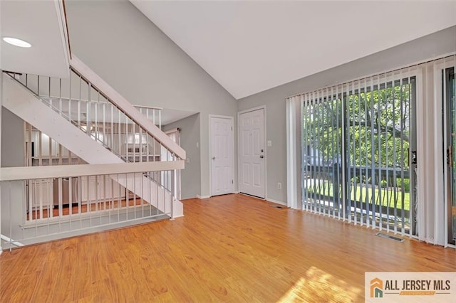 22 Witch Hazel Ct, South Brunswick, NJ 08852 - foyer entrance featuring stairs, wood finished floors, and high vaulted ceiling