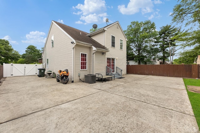 back of house with a patio area