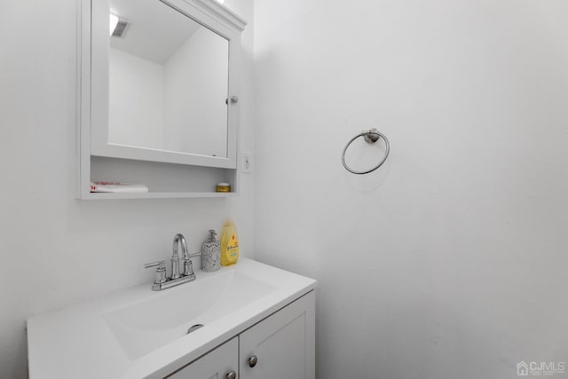 bathroom featuring visible vents and vanity