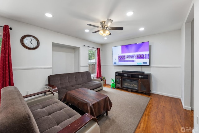 living area with a ceiling fan, baseboards, hardwood / wood-style floors, and recessed lighting