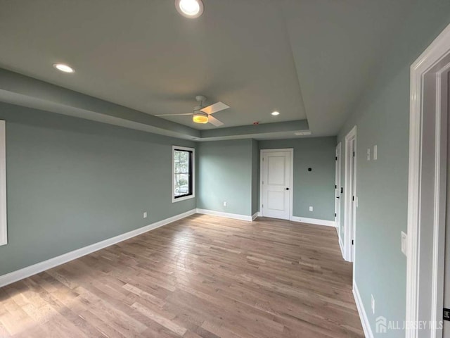 26 Morse Ave, Edison, NJ 08817 - unfurnished bedroom featuring wood finished floors, a raised ceiling, baseboards, recessed lighting, and ceiling fan