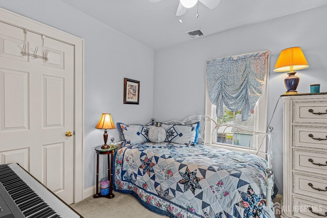 carpeted bedroom with baseboards and a ceiling fan