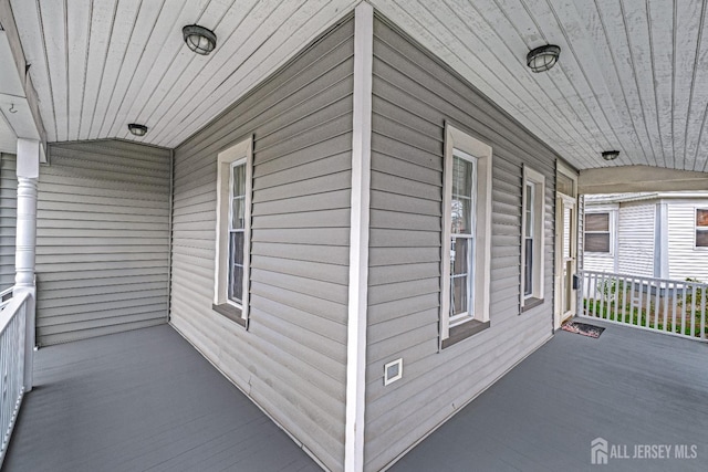view of property exterior featuring a porch