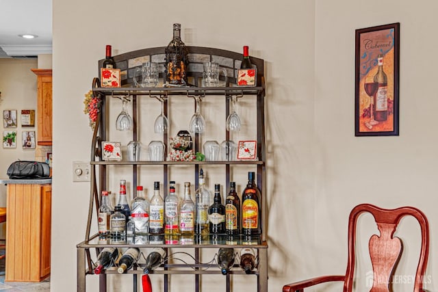 indoor dry bar featuring recessed lighting