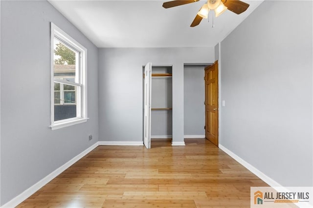 74 Charles St, Carteret, NJ 07008 - unfurnished bedroom with light wood-type flooring, baseboards, ceiling fan, and a closet