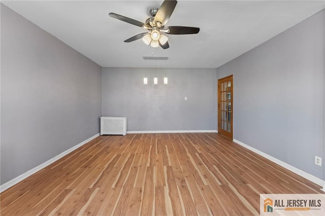 74 Charles St, Carteret, NJ 07008 - unfurnished room featuring light wood-style flooring, ceiling fan, and baseboards
