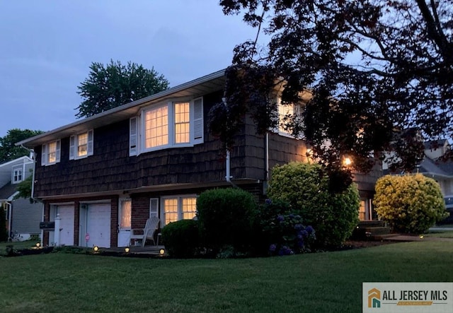 323 Green St, Woodbridge Proper, NJ 07095 - view of front facade featuring a yard and a garage