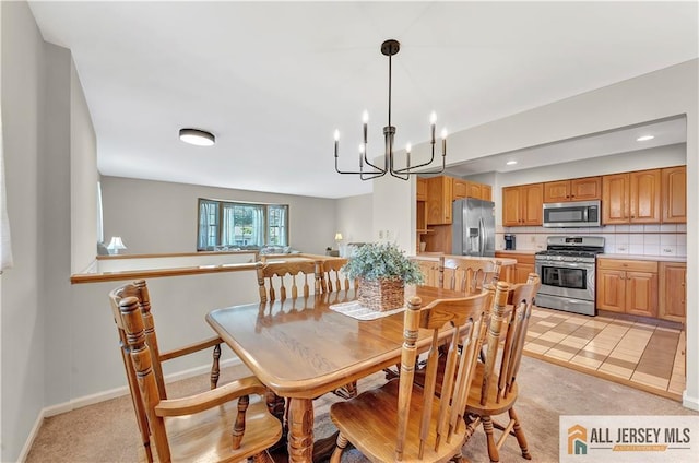323 Green St, Woodbridge Proper, NJ 07095 - dining room featuring a chandelier and light colored carpet