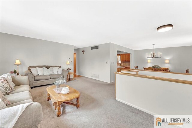323 Green St, Woodbridge Proper, NJ 07095 - living room with a chandelier and light carpet