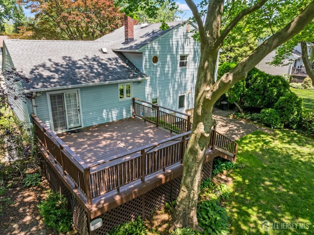 41 Winton Rd, East Brunswick, NJ 08816 - rear view of house with a shingled roof, a chimney, a wooden deck, and a yard