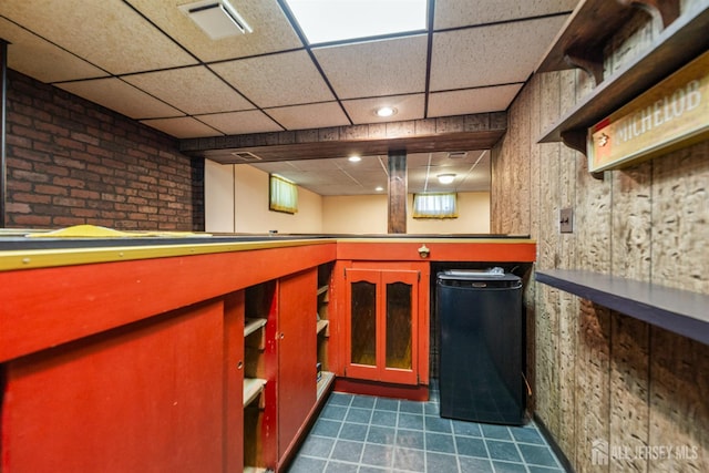 41 Winton Rd, East Brunswick, NJ 08816 - bar area with a paneled ceiling, dark tile patterned floors, and fridge