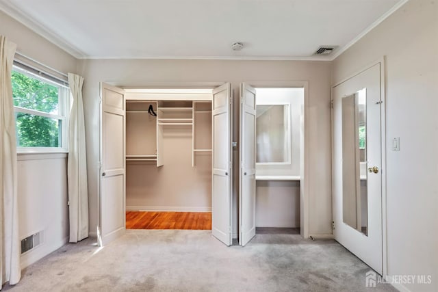 41 Winton Rd, East Brunswick, NJ 08816 - unfurnished bedroom featuring crown molding, carpet, baseboards, a walk in closet, and a closet