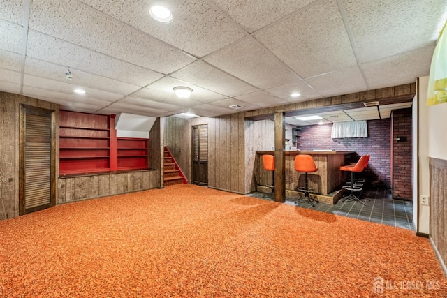41 Winton Rd, East Brunswick, NJ 08816 - finished below grade area with a bar, carpet floors, stairs, wooden walls, and a drop ceiling