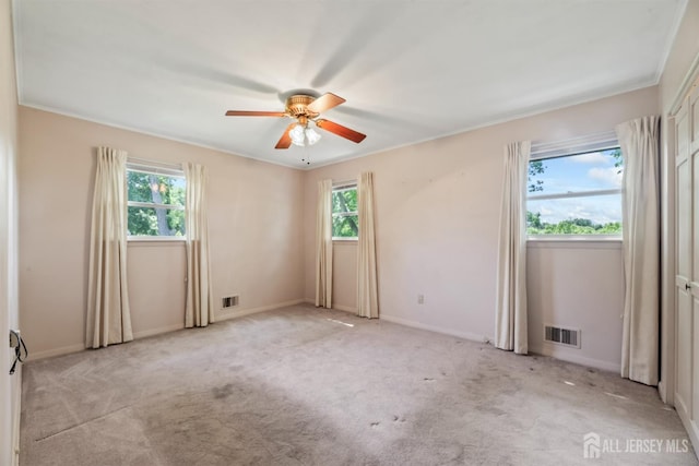 41 Winton Rd, East Brunswick, NJ 08816 - unfurnished room with plenty of natural light, a ceiling fan, light carpet, and baseboards