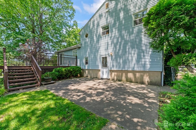 41 Winton Rd, East Brunswick, NJ 08816 - view of home's exterior featuring a patio, a wooden deck, and stairway