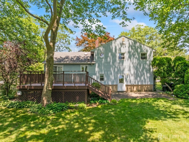 41 Winton Rd, East Brunswick, NJ 08816 - rear view of property with a yard, a wooden deck, a chimney, and roof with shingles