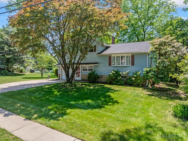 41 Winton Rd, East Brunswick, NJ 08816 - split level home featuring driveway, a front lawn, a chimney, and a garage