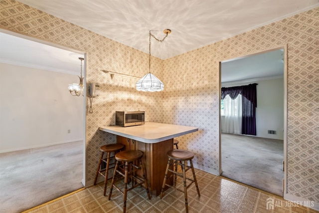 41 Winton Rd, East Brunswick, NJ 08816 - carpeted dining area featuring crown molding, wallpapered walls, and baseboards