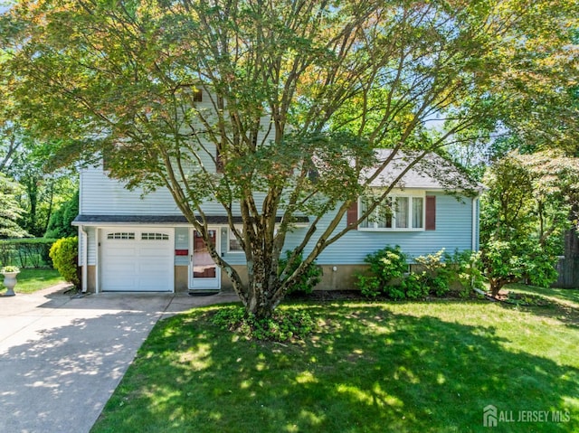 41 Winton Rd, East Brunswick, NJ 08816 - view of property hidden behind natural elements with a front yard, driveway, and an attached garage