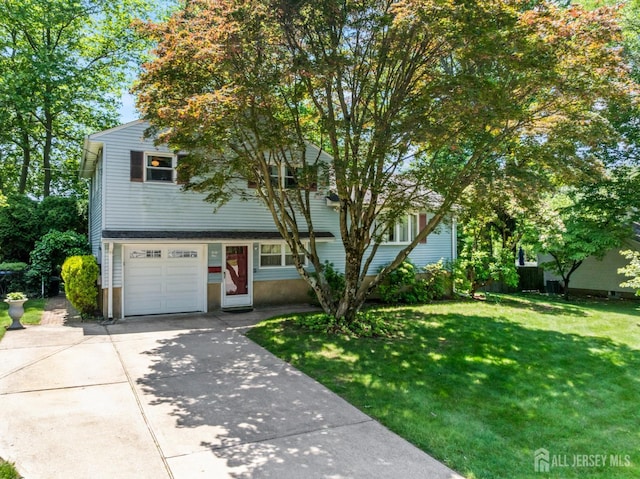41 Winton Rd, East Brunswick, NJ 08816 - view of front of home with a front lawn, driveway, and an attached garage