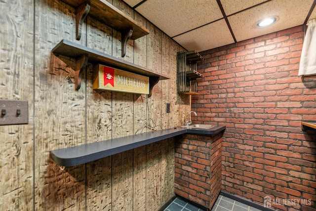 41 Winton Rd, East Brunswick, NJ 08816 - detailed view of a paneled ceiling, a sink, and brick wall