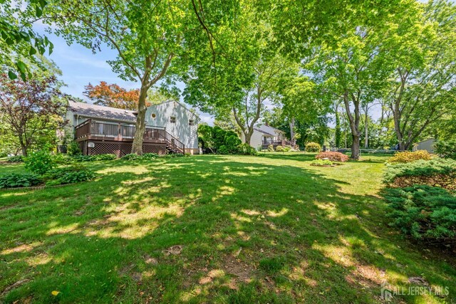 41 Winton Rd, East Brunswick, NJ 08816 - view of grassy yard featuring a wooden deck
