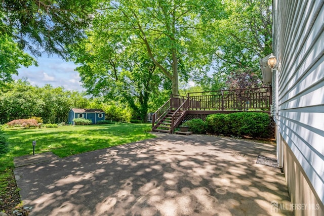 41 Winton Rd, East Brunswick, NJ 08816 - view of patio / terrace with an outdoor structure, a deck, stairway, and view of wooded area