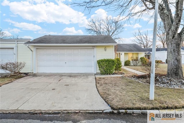 garage featuring driveway