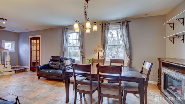 dining area with a chandelier and a wealth of natural light