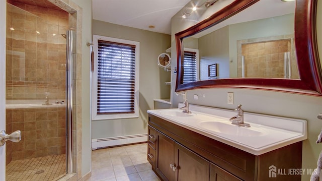 bathroom featuring a shower with door, a baseboard radiator, tile patterned flooring, and vanity