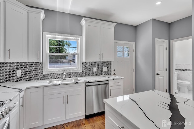 65 Bayview St, Aberdeen, NJ 07721 - kitchen featuring appliances with stainless steel finishes, white cabinetry, plenty of natural light, decorative backsplash, and recessed lighting