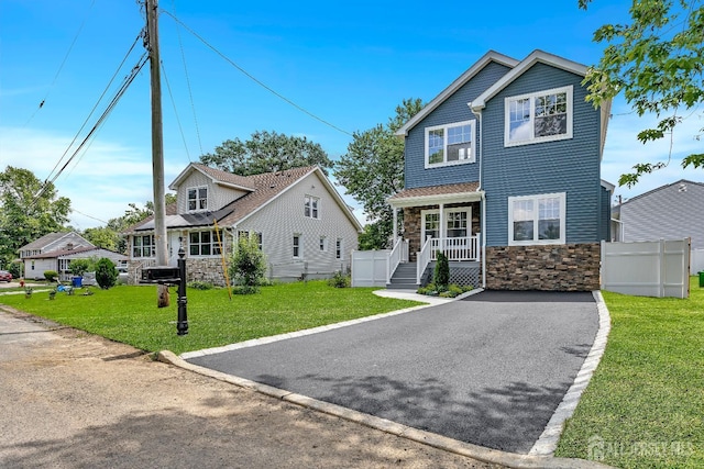65 Bayview St, Aberdeen, NJ 07721 - view of front of house with stone siding and covered porch