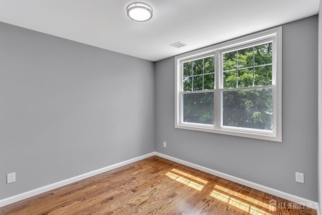 65 Bayview St, Aberdeen, NJ 07721 - spare room with baseboards and wood finished floors