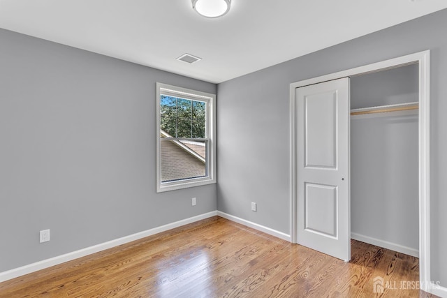 65 Bayview St, Aberdeen, NJ 07721 - unfurnished bedroom with wood finished floors and a closet