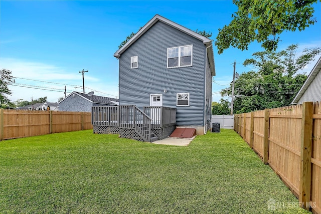 65 Bayview St, Aberdeen, NJ 07721 - rear view of house featuring a wooden deck and a fenced backyard
